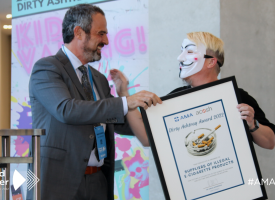 AMA President Dr Omar Khorshid presenting the Dirty Ashtray award to retailers who illegally sell vapes to children