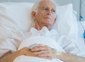 Older white man in hospital bed 