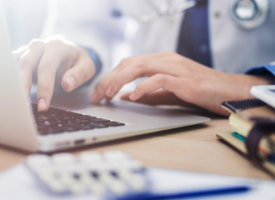 Doctor using laptop