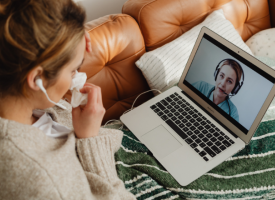 woman talking to doctor by computer