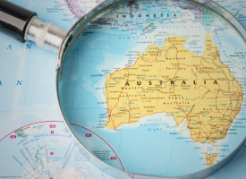 Magnifying glass over a map of Australia