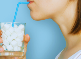 Woman drinking sugar through a straw