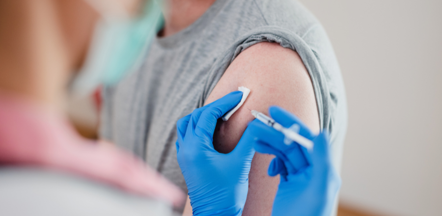 Doctor administering a vaccine